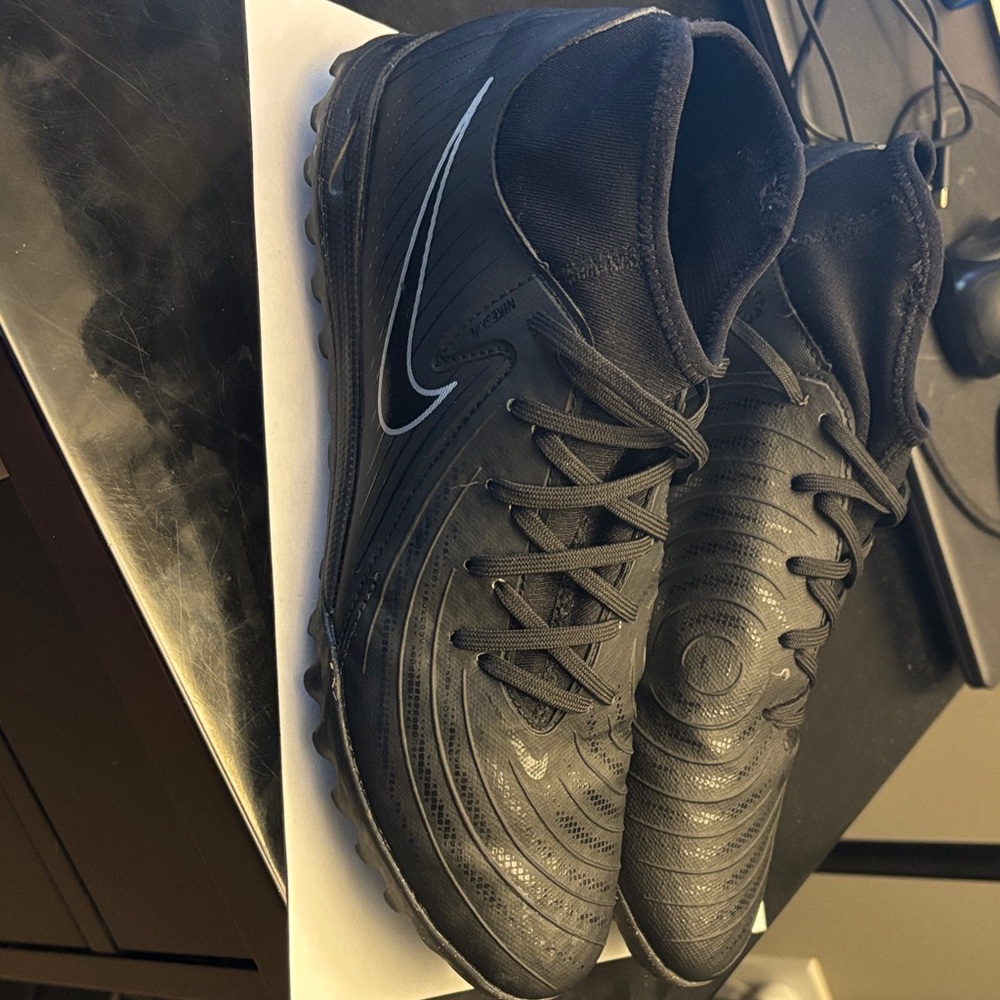 Nike Phantom Luna turf soccer shoes.